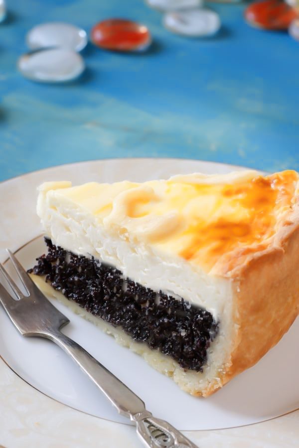 close-up of a slice of German Poppy Seed Cheesecake made with quark and shortcrust pastry 