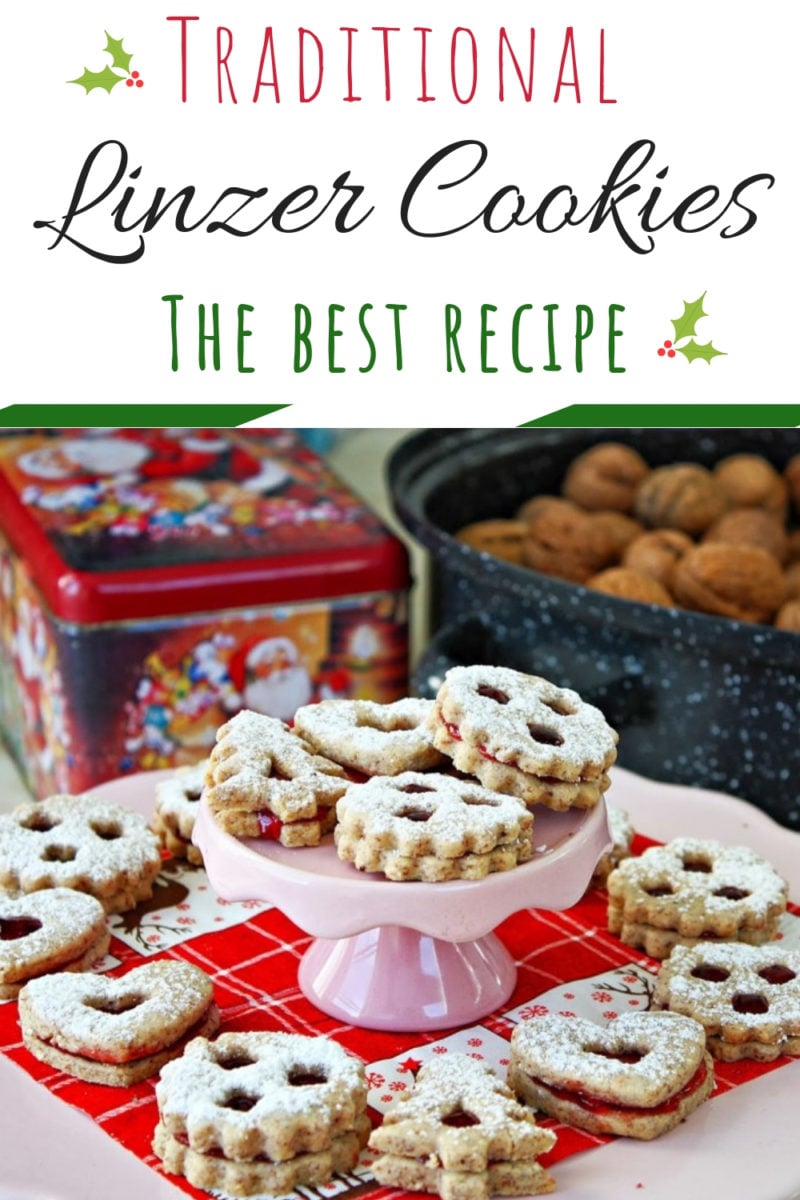 Traditional Linzer Cookies | These cute Austrian Christmas Cookies look stunning but are easy to make! A buttery almond and hazelnut sandwich cookie filled with raspberry jam and dusted with icing sugar! #holidaybaking, #linzercookies, #Christmascookies, #christmasbaking, #easychristmasrecipes