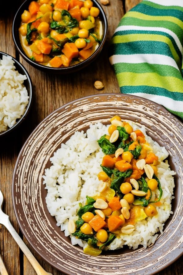easy vegan chickpea curry with coconut milk and pumpkin served on rice