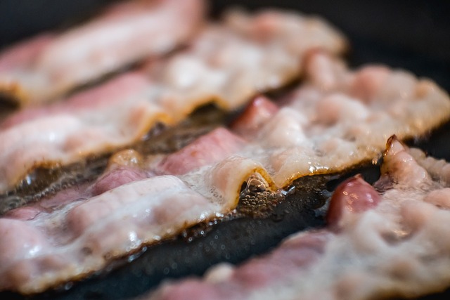 bacon frying in a griddle pan