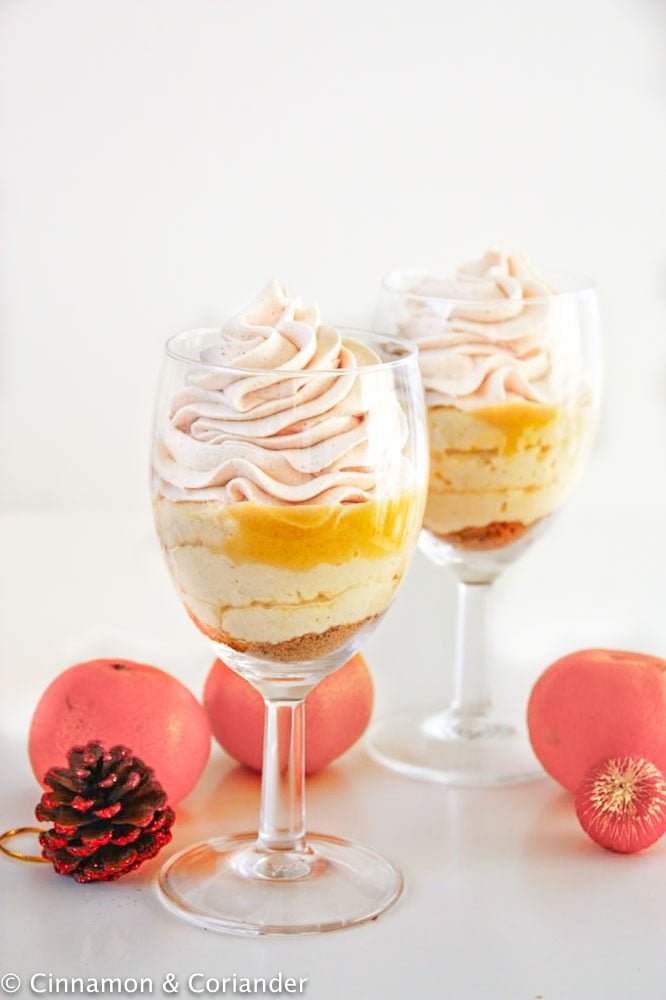 eggnog mousse with biscoff whipped cream and tangerine curd in a dessert glass