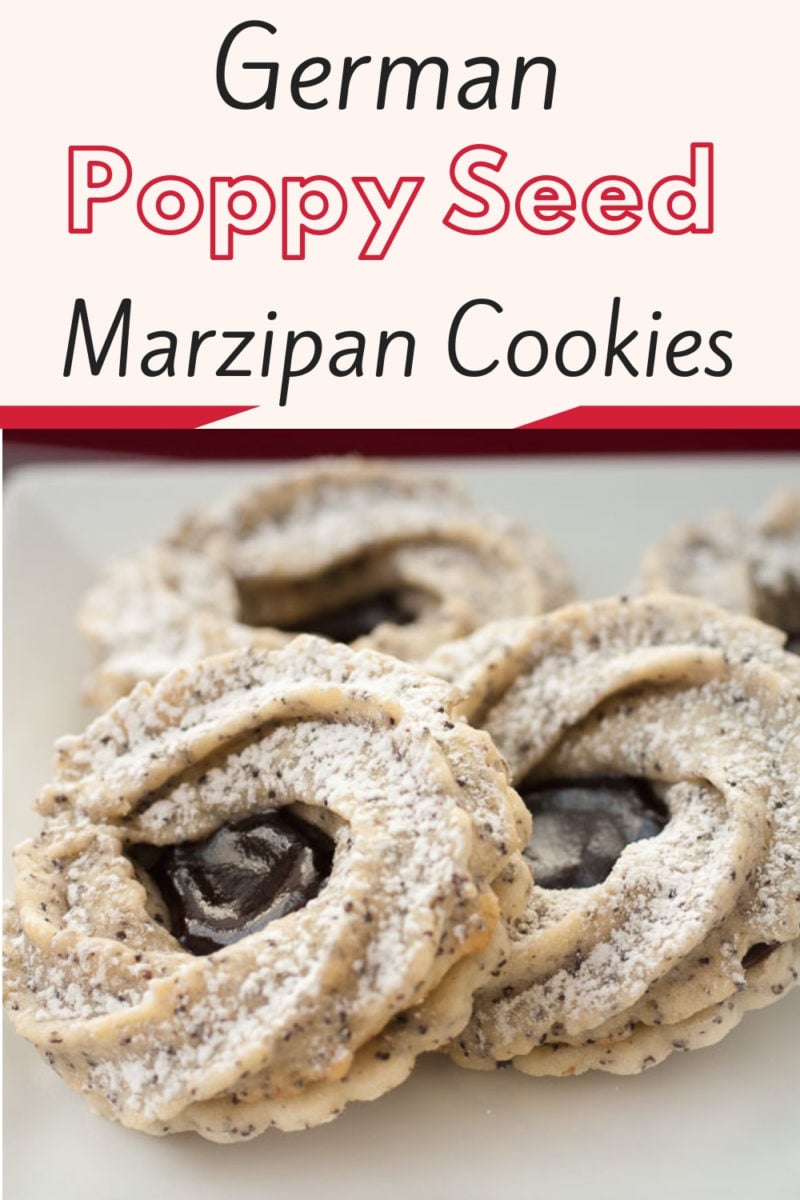 German marzipan cookies consist of a poppy seed shortbread cookie and a piped marzipan cookie sandwiched together with spiked jam! A traditional German Christmas cookie recipe to impress everyone! #germanchristmas, #christmascookies, #marzipan, #poppyseedcookies
