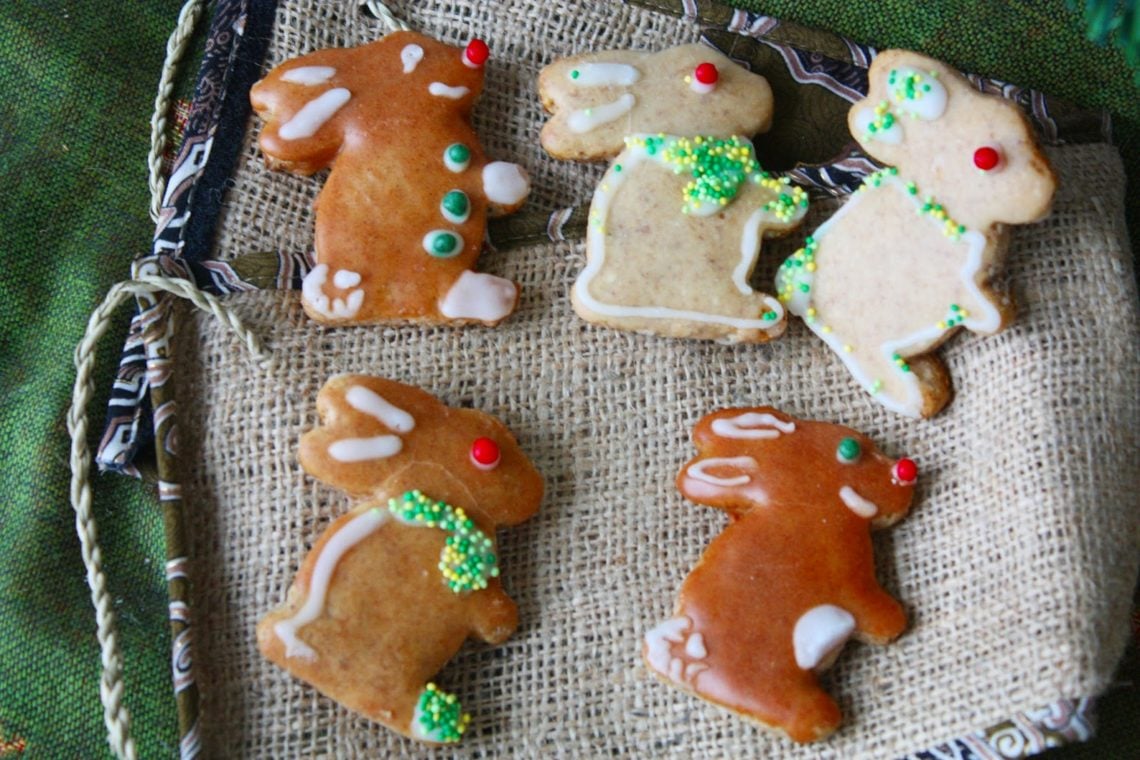 Soft gingerbread cookies in bunny shape on a dark brown cloth