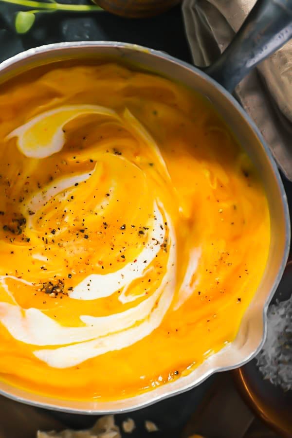 overhead shot of a pot with pureed butternut squash soup 