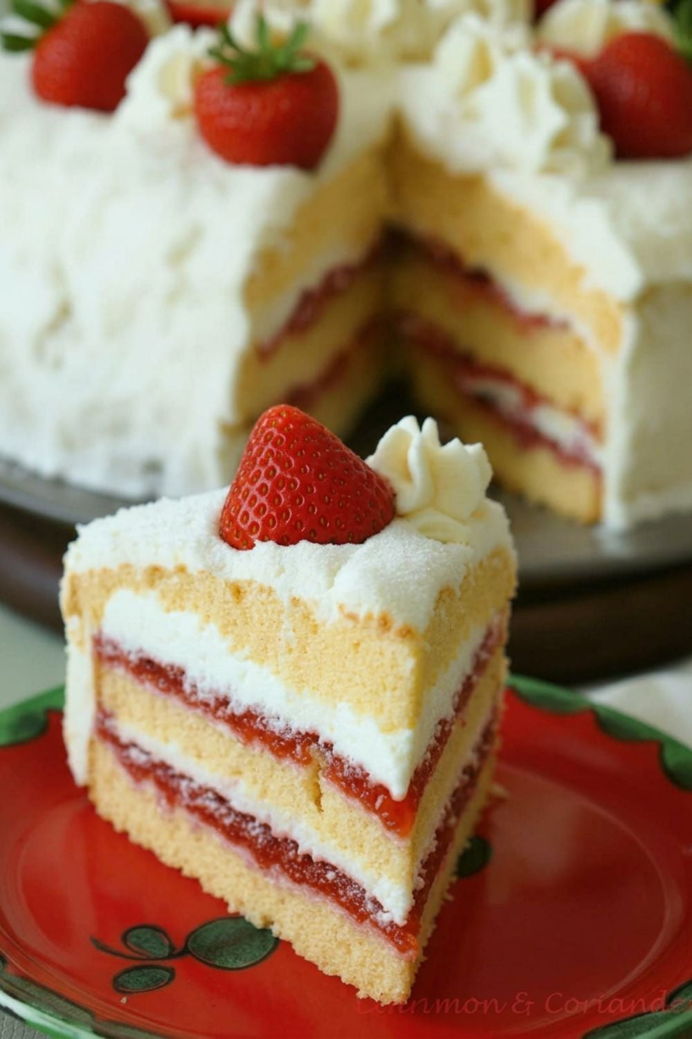 a slice of german strawberry coconut layer cake decorated with fresh strawberries