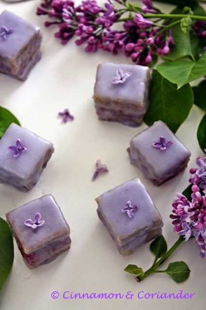 lilac jelly petit fours decorated with edible flours