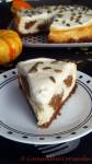 a slice of pumpkin cake cheesecake with sour cream topping