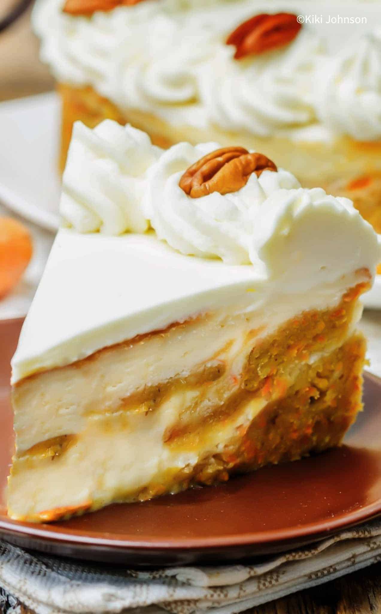 a slice of pumpkin cake cheesecake with pumpkin swirl on a brown plate.
