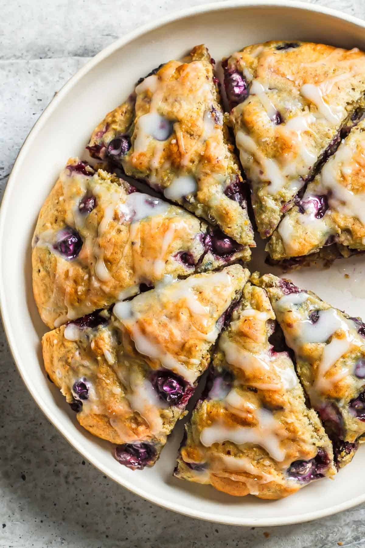 Starbucks Blueberry Scones drizzled with lemon icing served in a baking dish 