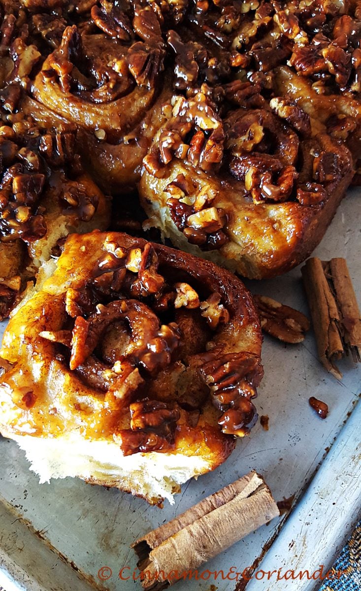 Fluffy Caramel Sticky Buns with a perfect ooey caramel glaze and chopped pecans on top 