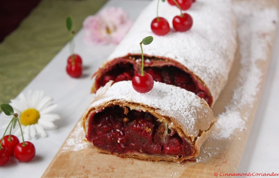 homemade Viennese Style Cherry Strudel on a cutting board