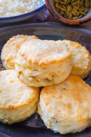 Easy flaky homemade Buttermilk Biscuits with Cheddar on a small blue plate