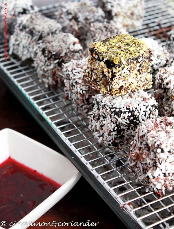 double chocolate cherry lamingtons cooling on a rack