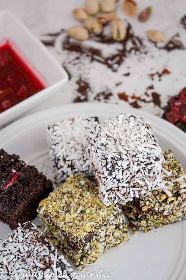 double chocolate lamingtons with sour cherry filling on a white platter