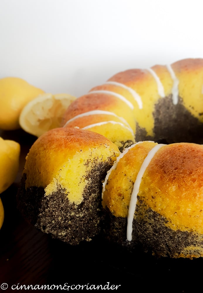 Moist German Poppy Seed Cake with Lemon Glaze on a cake plate