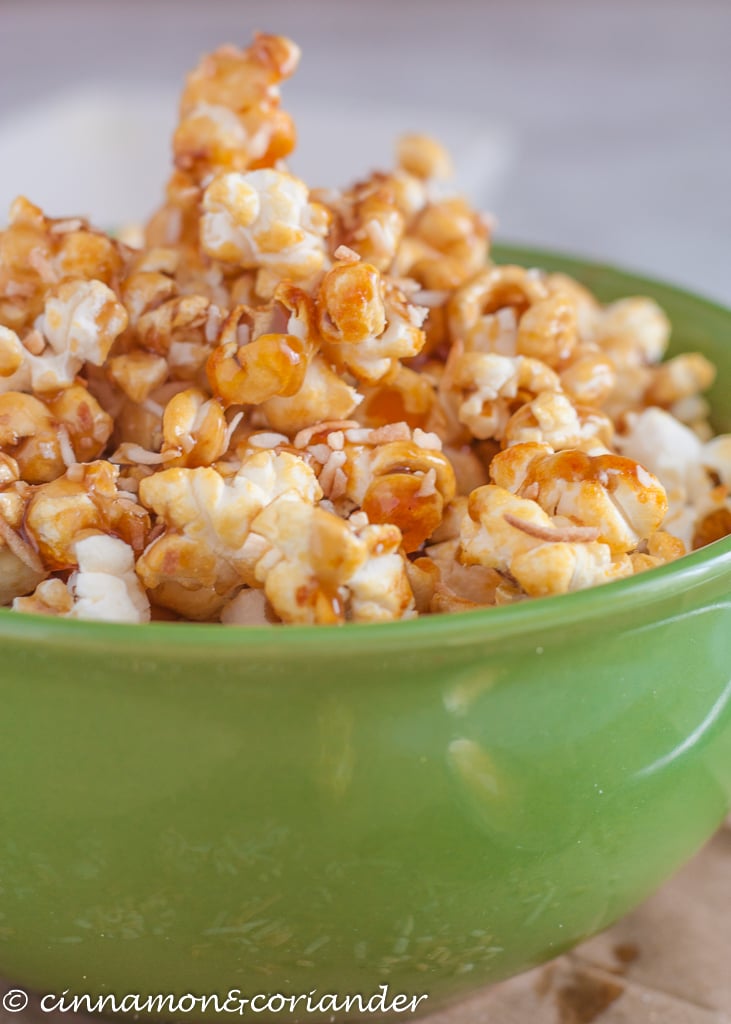 Vegan Coconut Caramel Popcorn in a green bowl - side view