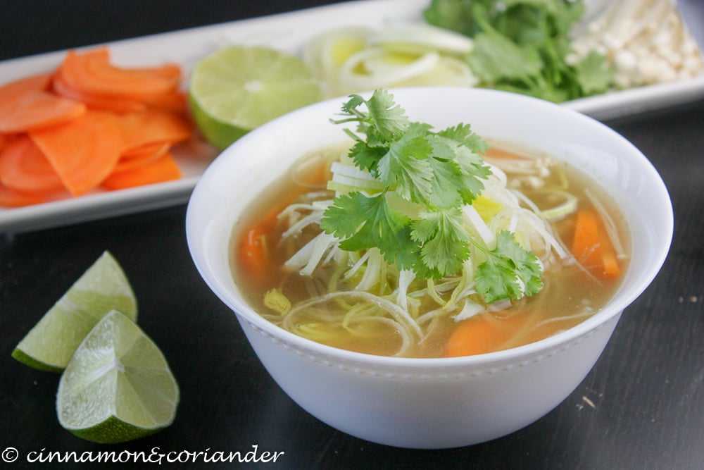 Vegan Vietnamese Noodle Soup Pho served in a small white bowl with lime wedged on the side