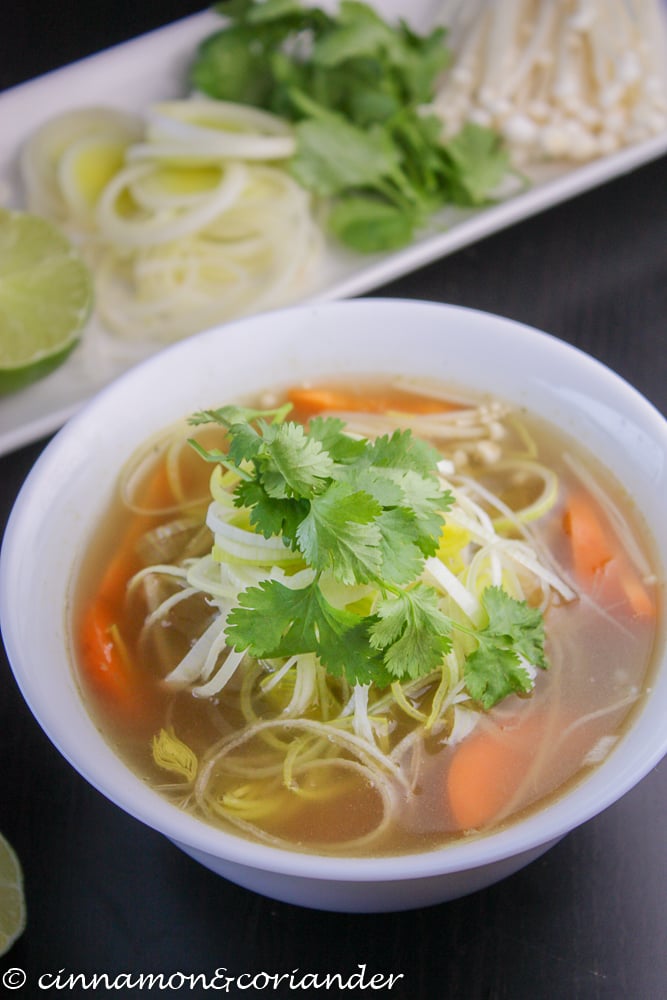 vegan Vietnamese Pho topped with fresh cilantro in a small white soup bowl