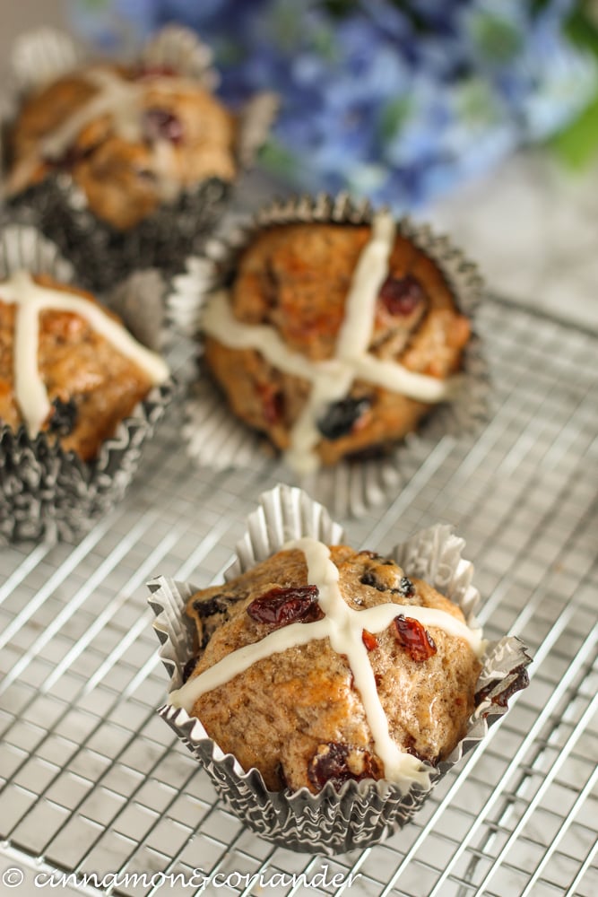 Hot Cross Muffins for Easter Brunch with dried cranberries and raisins on a cooling rack