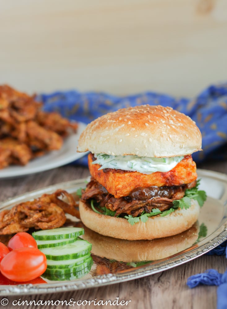 Indian Veggie Burger with Onion Bhaji Chili Garlic Paneer Mango Chutney and Cucumber Mint Raita