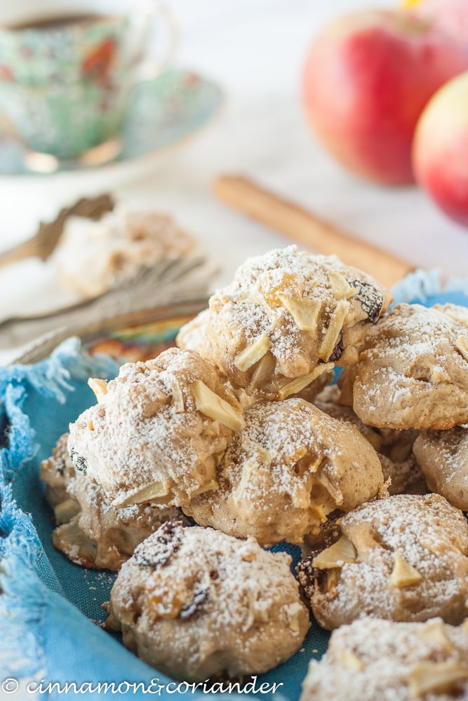 German Apple Cake Cookies with Almonds and Rum Raisins dusted with powdered sugar arranged on a plate