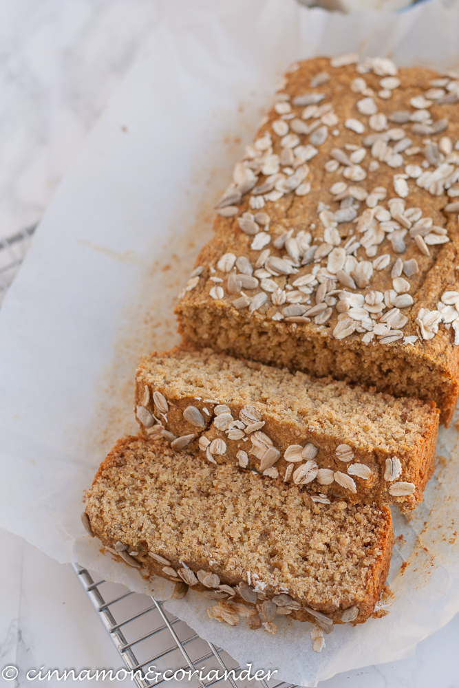 a loaf of gluten-free healthy Vegan Banana Bread on a piece of white parchment paper