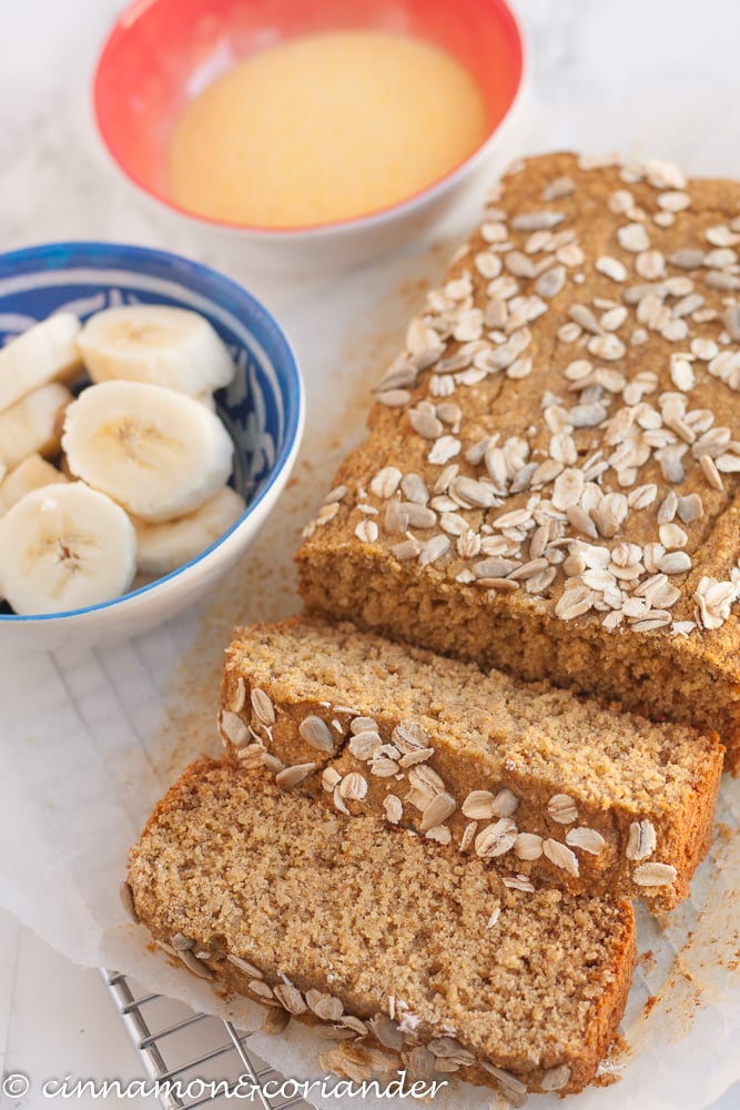 healthy vegan banana bread with cornmeal and oat flour with two slices cut