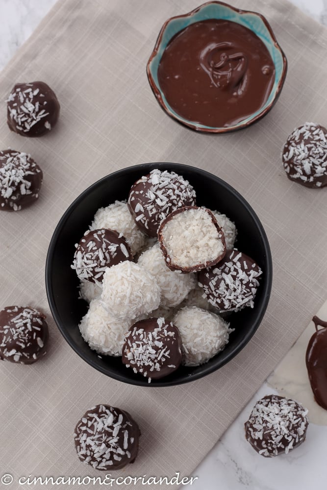 easy healthy coconut truffles in a black bowl