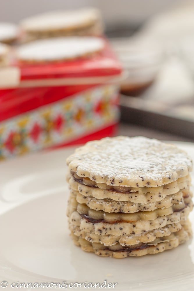three stacked Poppy Seed Marzipan Sandwich Cookies filled with marzipan and plum jam