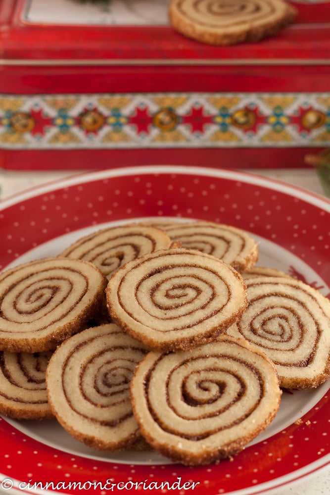 easy cinnamon roll cookies on a festive Christmas plate