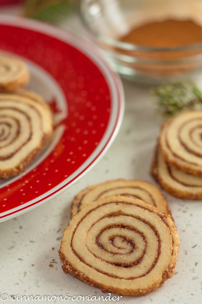 close-up of Cinnamon Roll Cookies arranged on a table decorated for Christmas