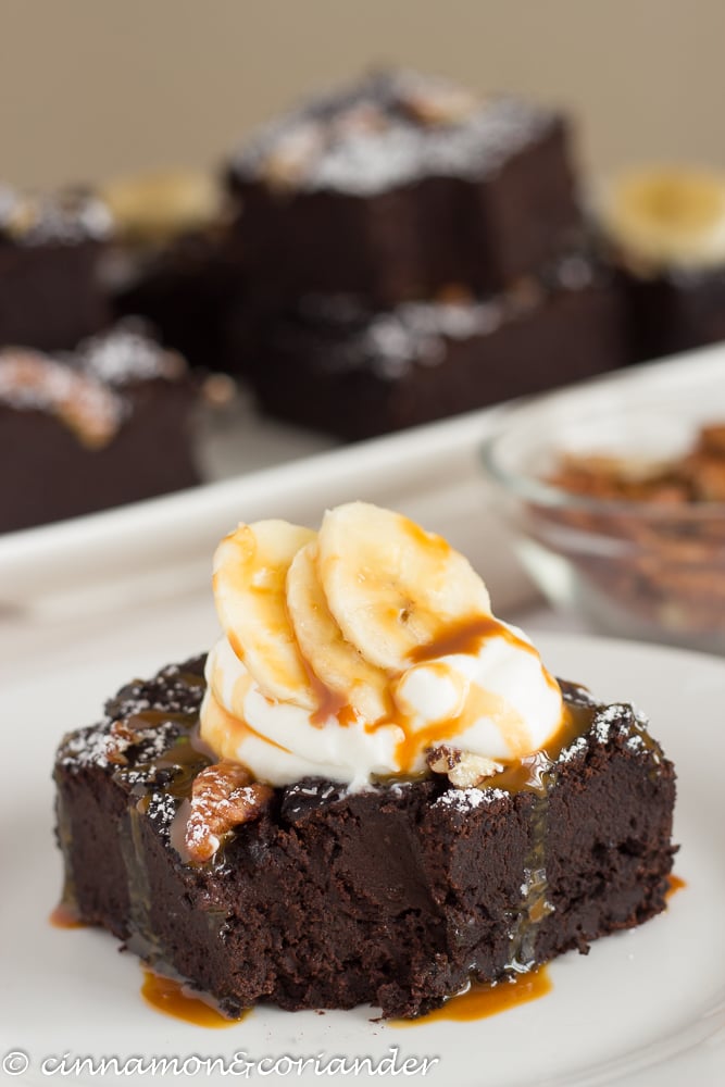 Fudgy Vegan Black Bean Banana Brownies served drizzled with Coconut Caramel