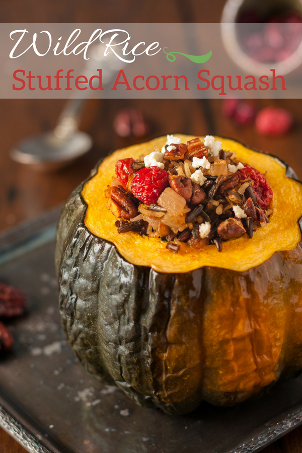 This Vegetarian Stuffed Acorn Squash recipe inspired by Canadian First Nation's Cuisine is the perfect vegetarian main course for your Thanksgiving table. Tender baked squash filled with wild rice, toasted pecans, dried sour cherries and creamy goat cheese! Skip the cheese for a vegan stuffed squash!  #healthy, #vegetarian, #easy, #fall, #thanksgiving, #side