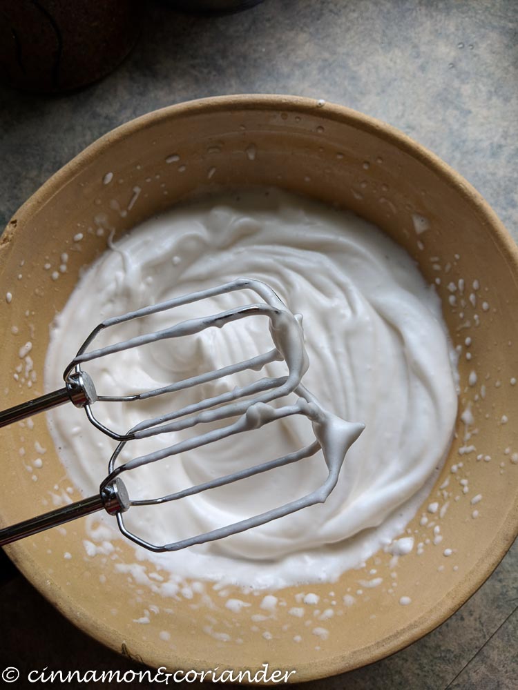 perfectly stiff whipped aquafaba (chickpea water) in a bowl