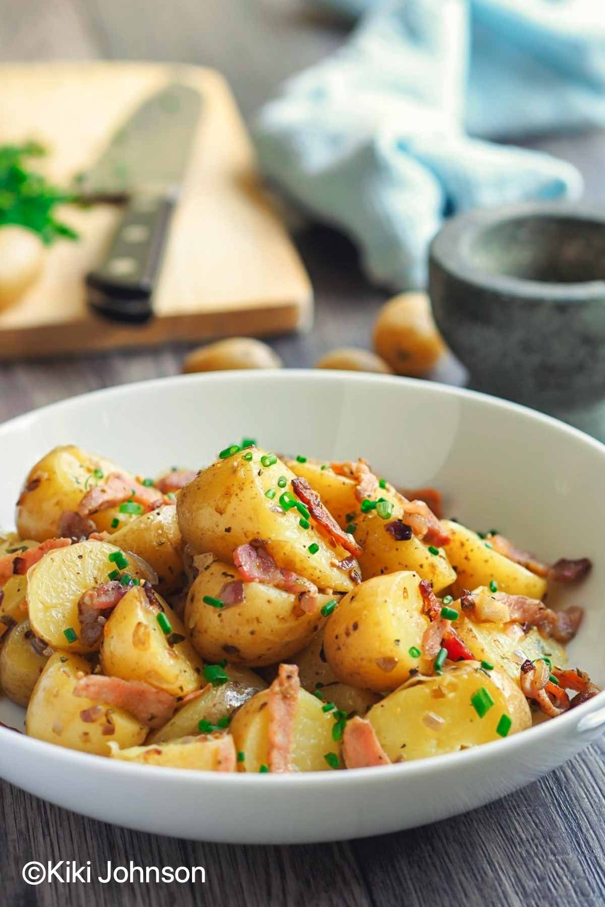 warm Bavarian Potato Salad served in a white bowl 