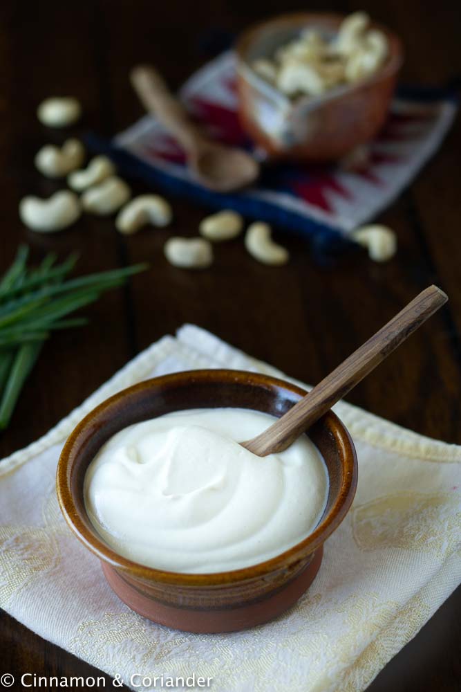 easy vegan sour cream made from cashew nuts served in a rustic small bowl (vegan sour cream recipe)