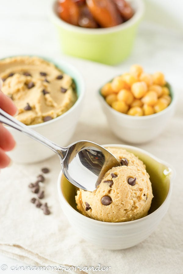 a spoon digging into a scoop of vegan chickpea cookie dough