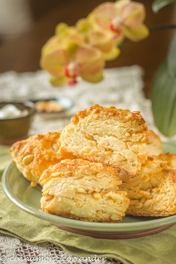 side view of a plate of honey scones with Greek yogurt and pine nuts 