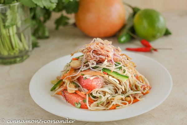 vegan Vietnamese rice noodle salad with grapefruit on a white plate