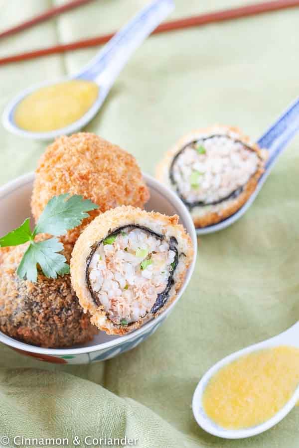 Crispy Fried Rice Balls with Tuna Filling and Panko Breading served in a Japanese Bowl