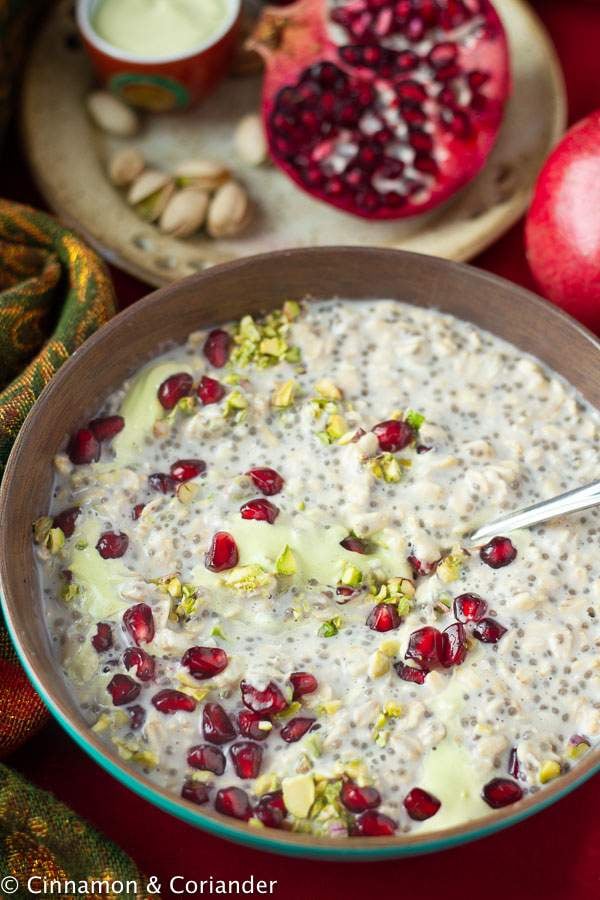 overhead shot of a bowl of rosewater, pistachio and pomegranate overnight oats 