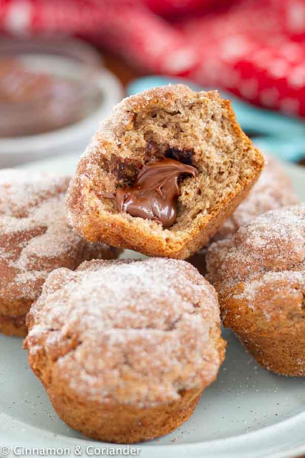 Nutella-stuffed Gingerbread Snickerdoodle Muffins on a blue plate