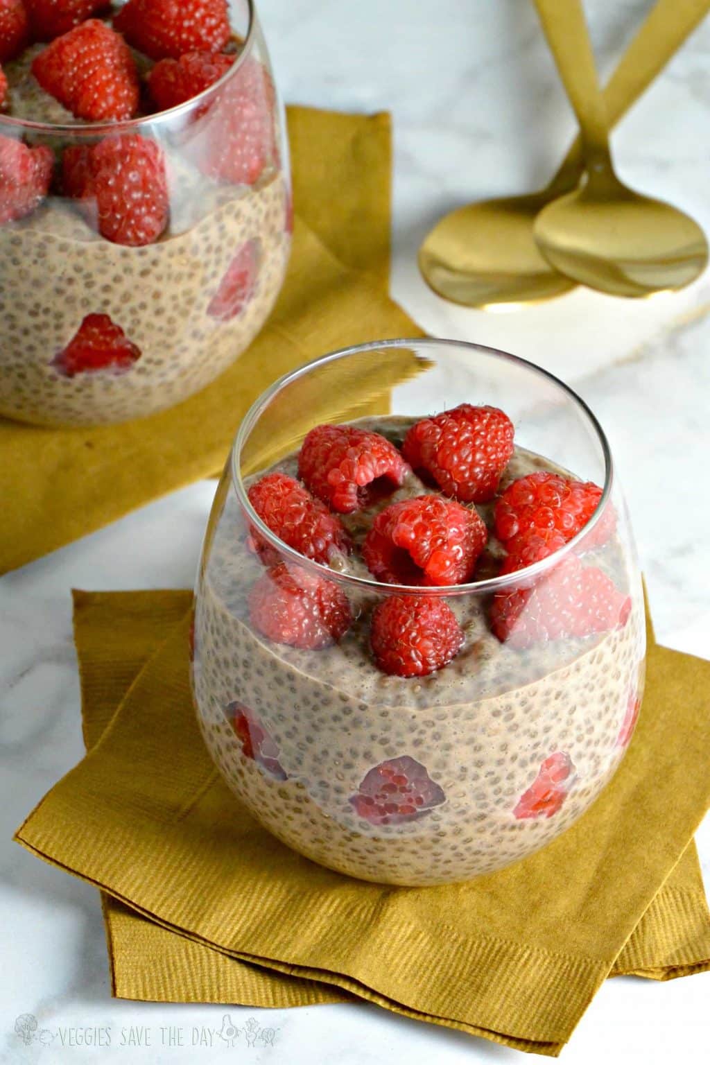 Chocolate Chia Pudding with fresh raspberries in a dessert glass