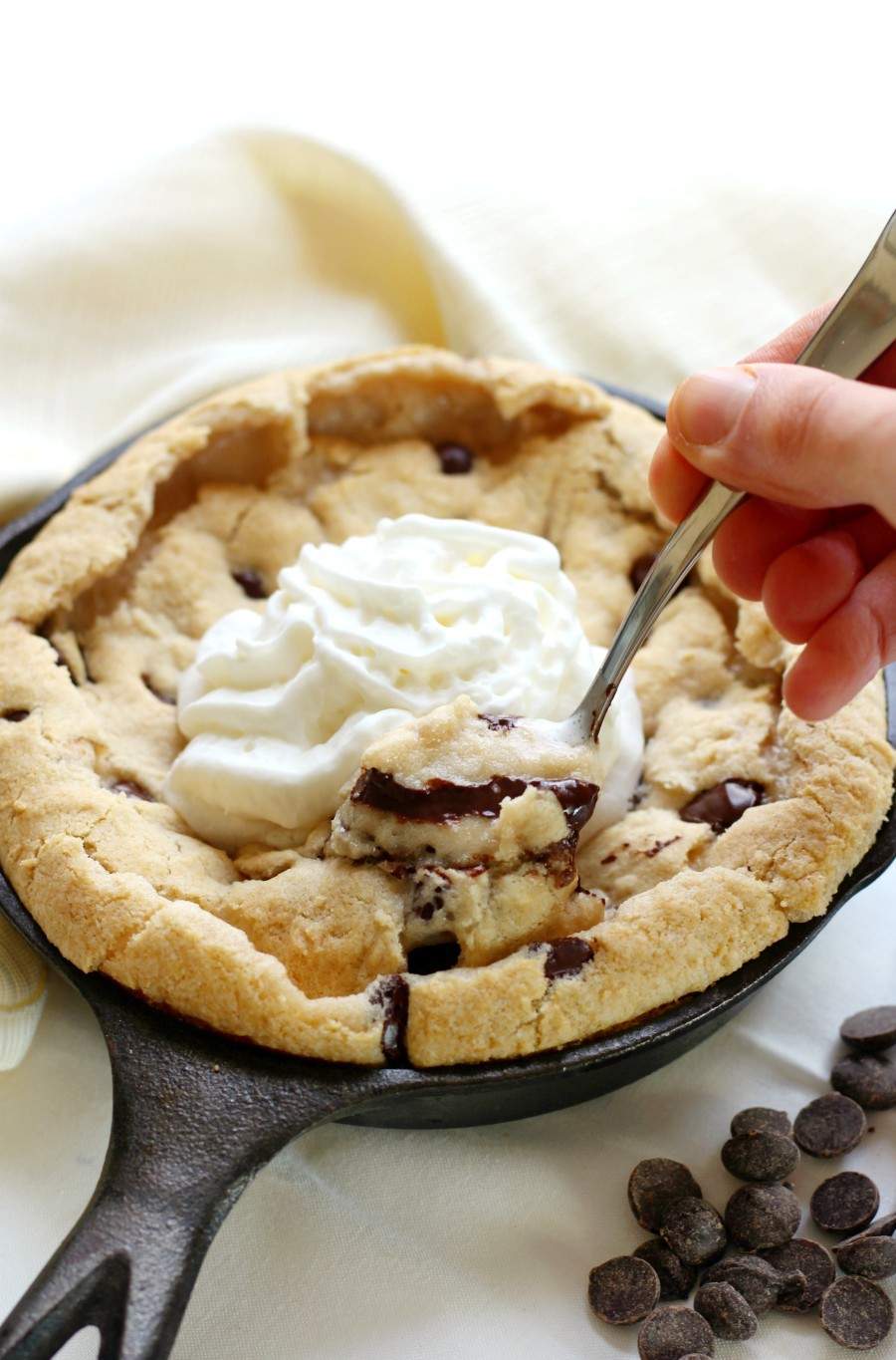 Vegan Paleo Chocolate Chip Skillet Cookie in black skillet served as Valentine's Dessert for two