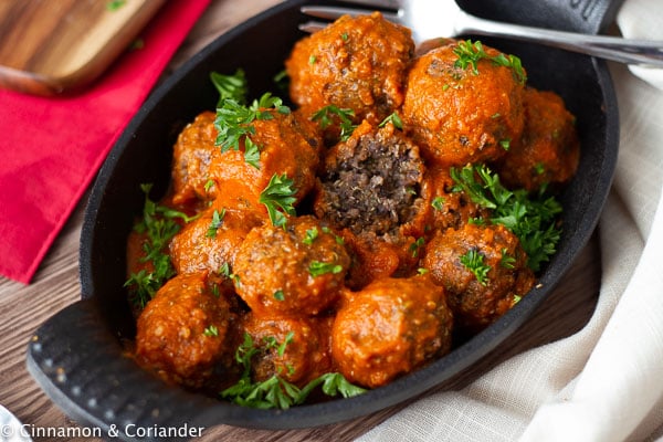 Vegan Meatballs with black beans served with red pepper sauce