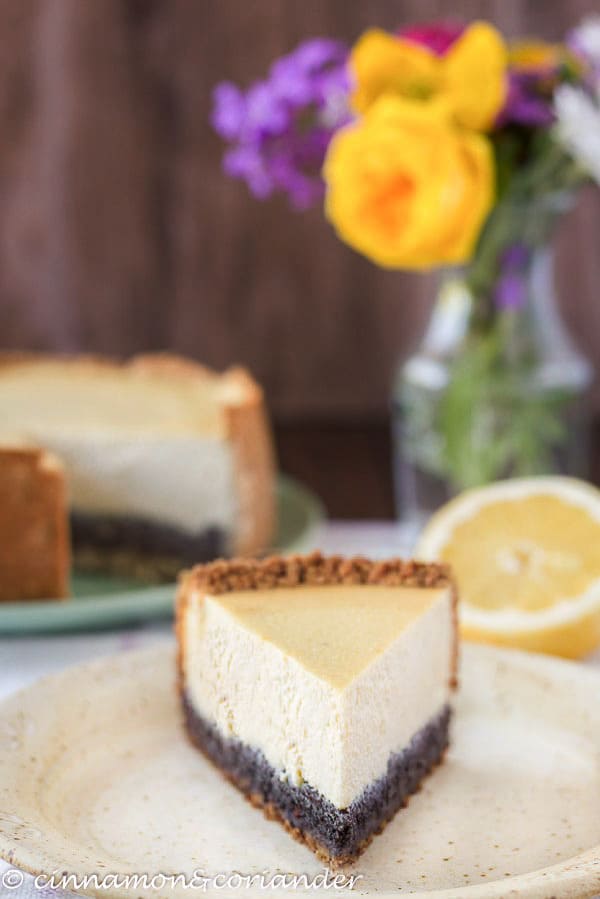 tofu cheesecake a slice of vegan German Poppyeed Cheesecake with flowers in the background