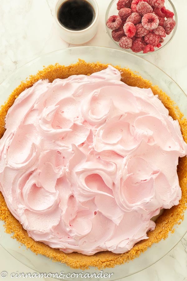 overhead shot of peanut butter and jelly flapper pie with raspberry meringue topping