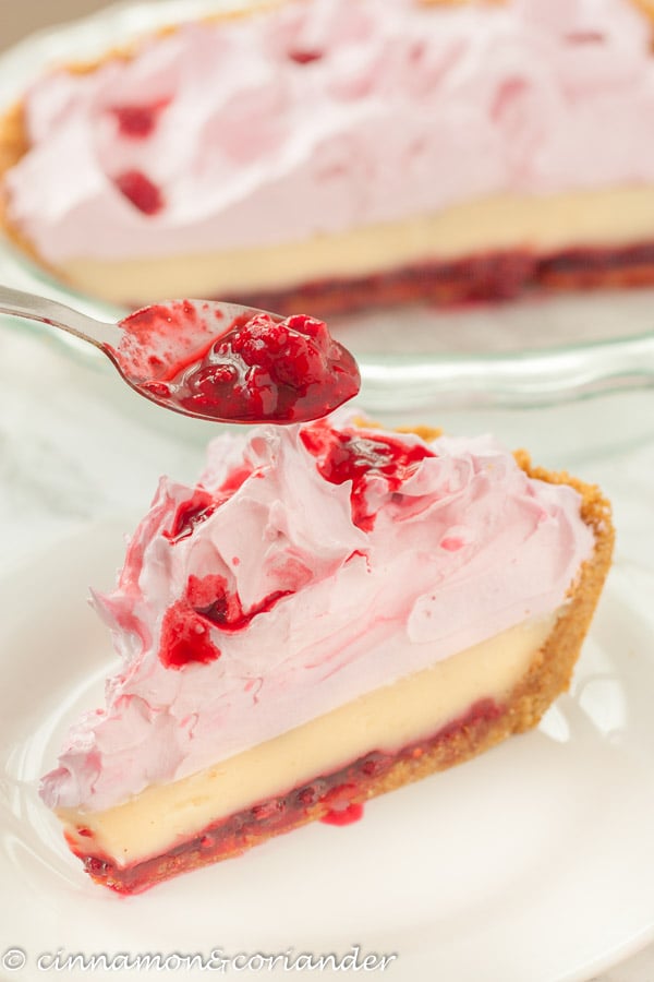 side view of a slice of flapper pie with raspberry meringue topping