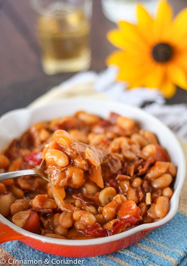 Bacon Molasses Baked Beans in a white skillet