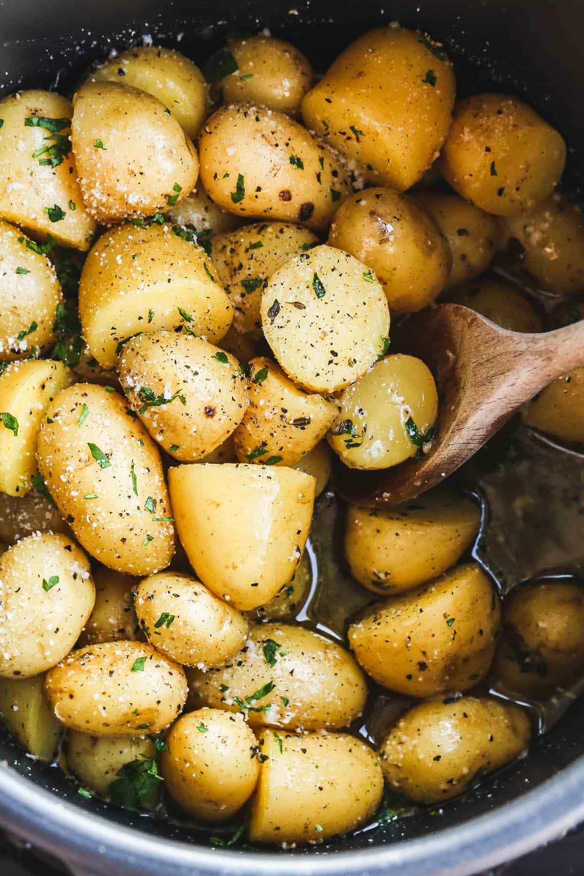 overhead shot of Instant Pot Potatoes being stirred in a pressure cooker